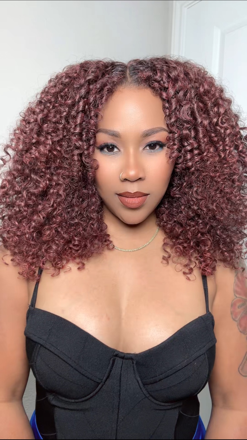 Burgundy defined curly hairstyle