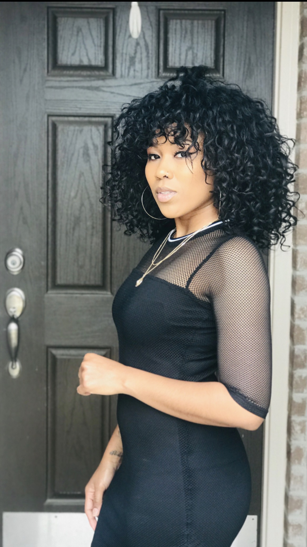 Natural curly hairstyle showing length